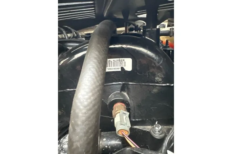 Slide: The Image of Close-up of a 2004 Chaparral Signature 350 engine component with visible serial number. - 14