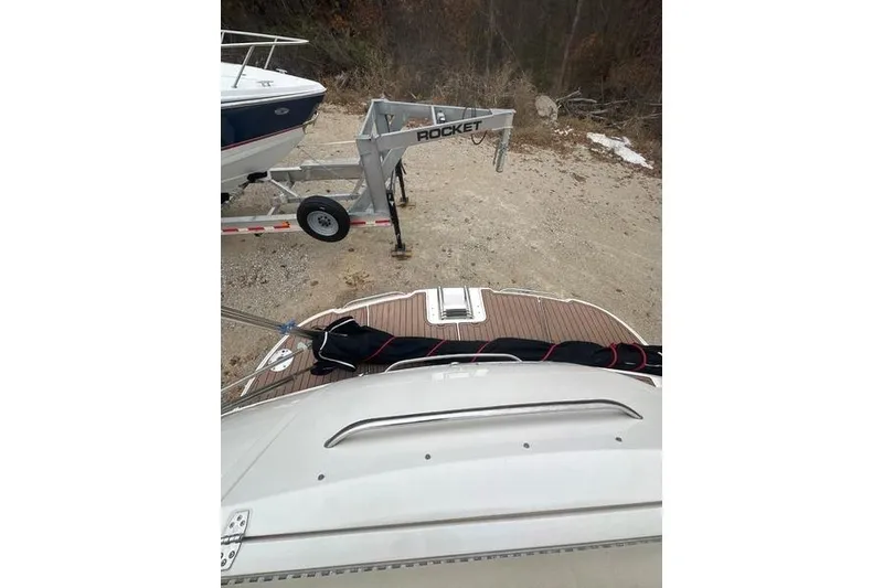 Slide: The Image of 2004 Chaparral Signature 350 boat on trailer, rear view with wooden deck. - 2