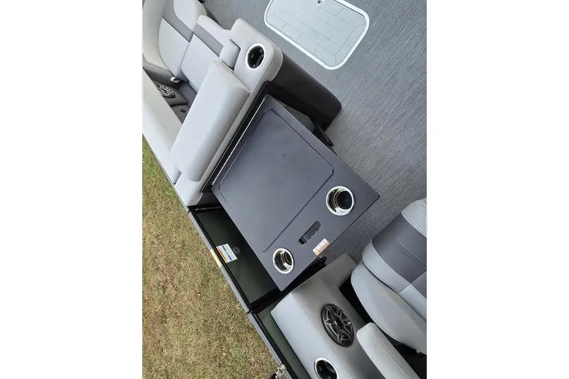 Slide: The Image of Interior of 2026 Godfrey Monaco 235 SDB boat with seating and storage compartments. - 12