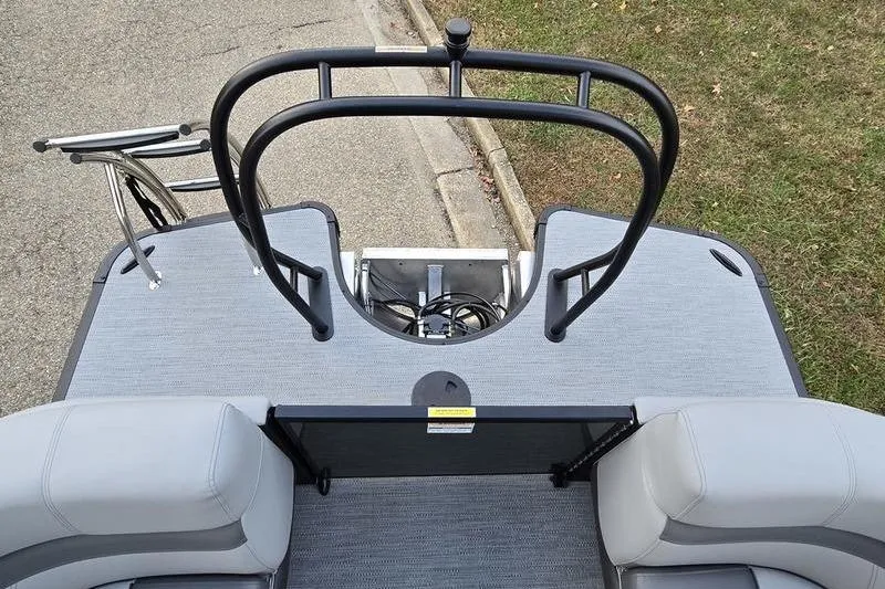 Slide: The Image of 2026 Godfrey Monaco 235 SDB boat deck with seating and safety railings. - 15