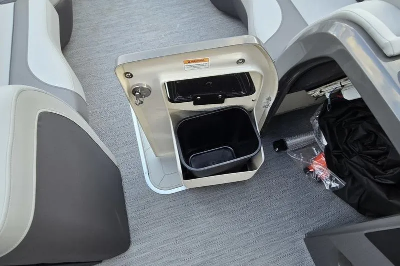 Slide: The Image of Interior of 2026 Godfrey Monaco 235 SDB boat with open storage compartment. - 17