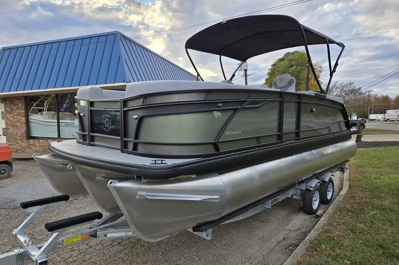 Slide: The Image of 2026 Godfrey Monaco 235 SDB pontoon boat on trailer, parked outdoors. - 3