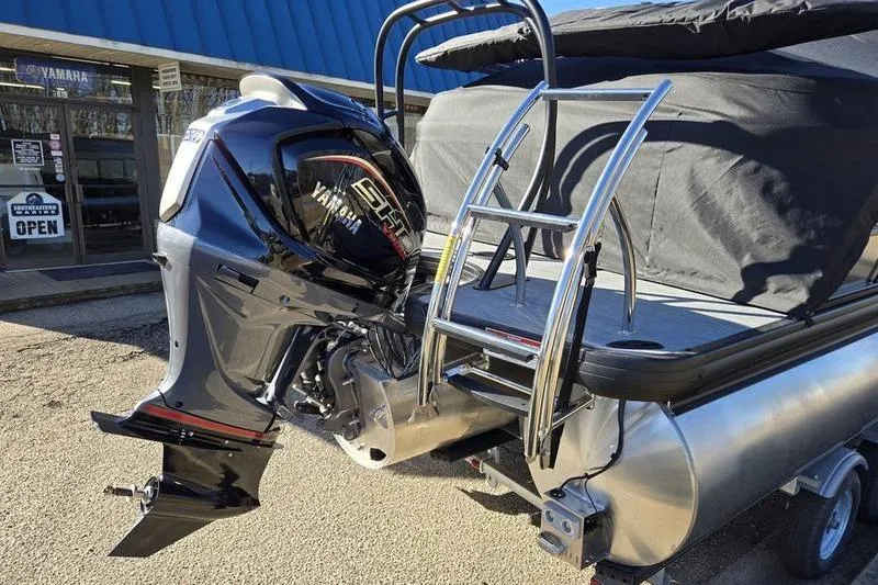 Slide: The Image of 2026 Godfrey Monaco 235 SDB boat with Yamaha outboard motor and ladder. - 5