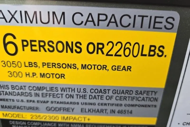 Slide: The Image of Capacity label for 2026 Godfrey Monaco 235 SDB: 6 persons or 2260 lbs, 300 HP motor. - 7