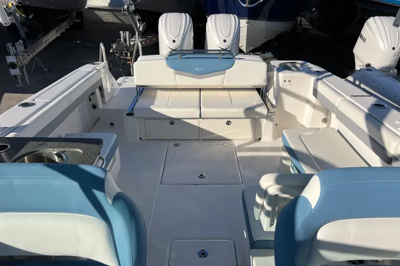 Slide: The Image of 2026 Robalo R317 Dual Console boat interior with seating and amenities. - 20