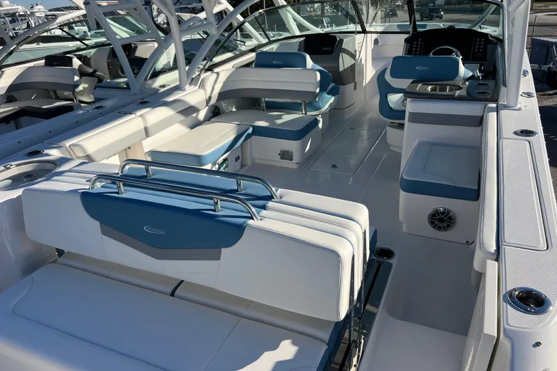 Slide: The Image of 2026 Robalo R317 Dual Console boat interior with blue and white seating. - 6