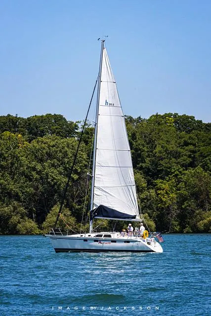 The Image of 1995 Hunter 35.5 sailboat on a tranquil lake. - 0