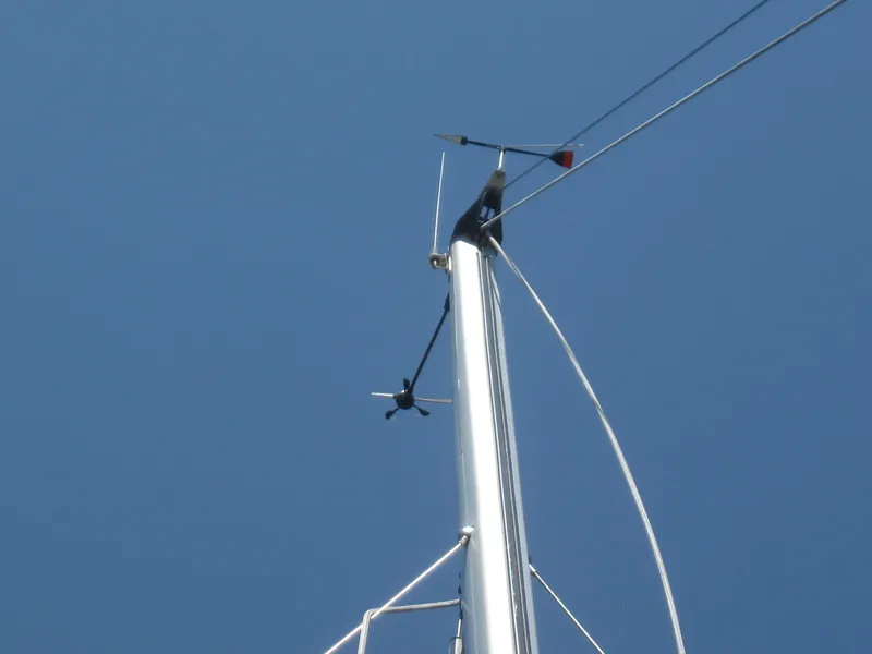 Slide: The Image of Mast of a 1995 Hunter 35.5 sailboat against blue sky. - 10