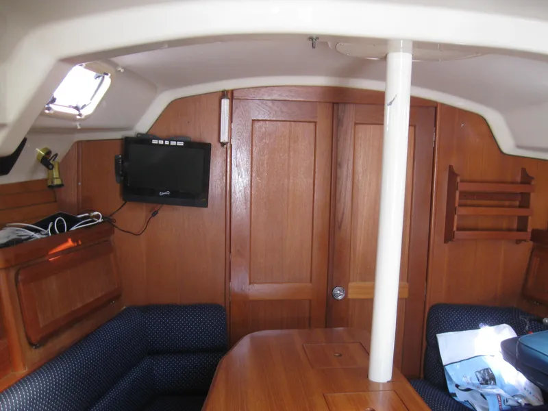 Slide: The Image of Interior of a 1995 Hunter 35.5 yacht with wooden furnishings. - 26