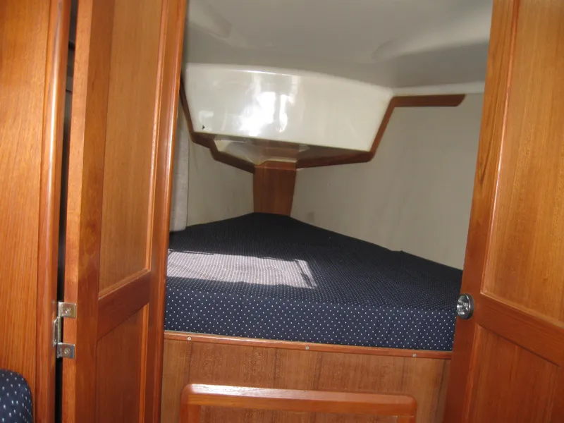 Slide: The Image of 1995 Hunter 35.5 yacht cabin interior with wooden finish. - 27