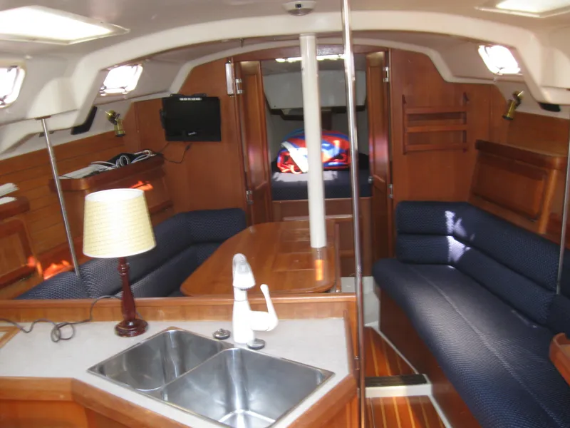 Slide: The Image of Interior of a 1995 Hunter 35.5 yacht with cozy furnishings. - 29