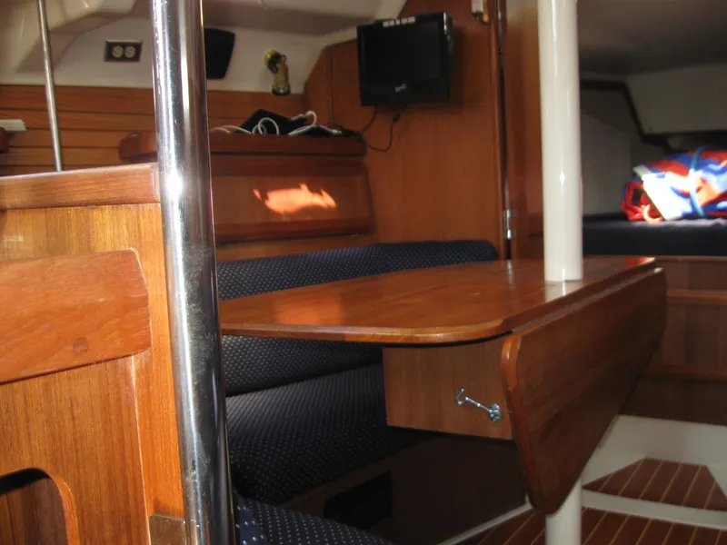 Slide: The Image of Interior of a 1995 Hunter 35.5 yacht with wooden furnishings. - 31
