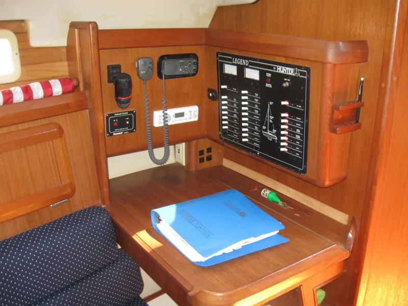 Slide: The Image of 1995 Hunter 35.5 yacht navigation station with control panel. - 32
