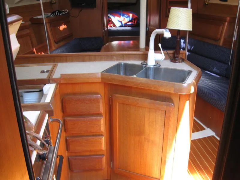 Slide: The Image of Interior of a 1995 Hunter 35.5 yacht with wooden cabinetry. - 36