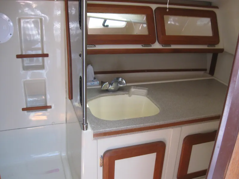 Slide: The Image of Interior of a 1995 Hunter 35.5 yacht with sink and storage. - 41