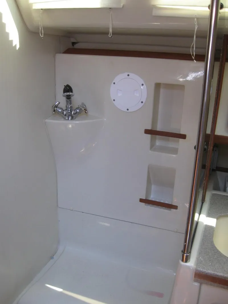 Slide: The Image of Interior of a 1995 Hunter 35.5 yacht with sink and storage. - 42