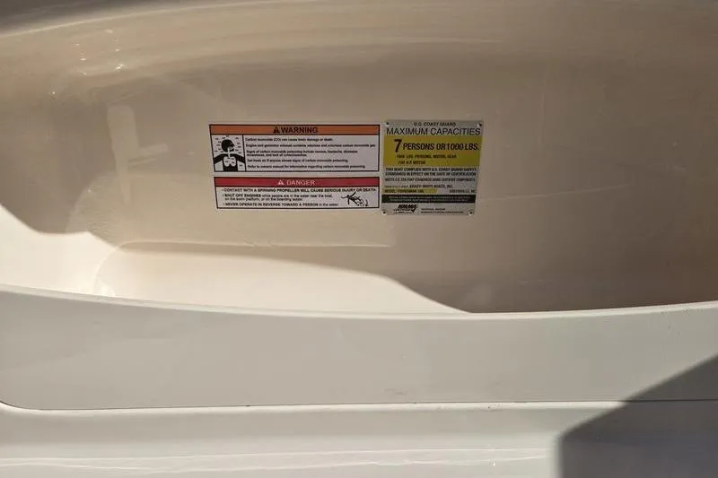 Slide: The Image of 2026 Grady-White Fisherman 180 capacity warning label, 7 persons or 1080 lbs. - 10