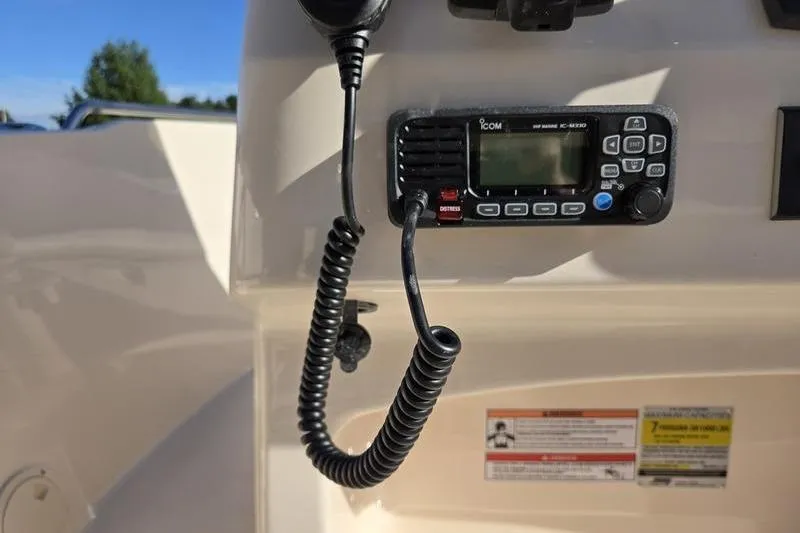 Slide: The Image of VHF radio on 2026 Grady-White Fisherman 180 boat dashboard. - 11