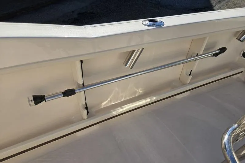 Slide: The Image of 2026 Grady-White Fisherman 180 boat interior with rod holder and sleek design. - 7