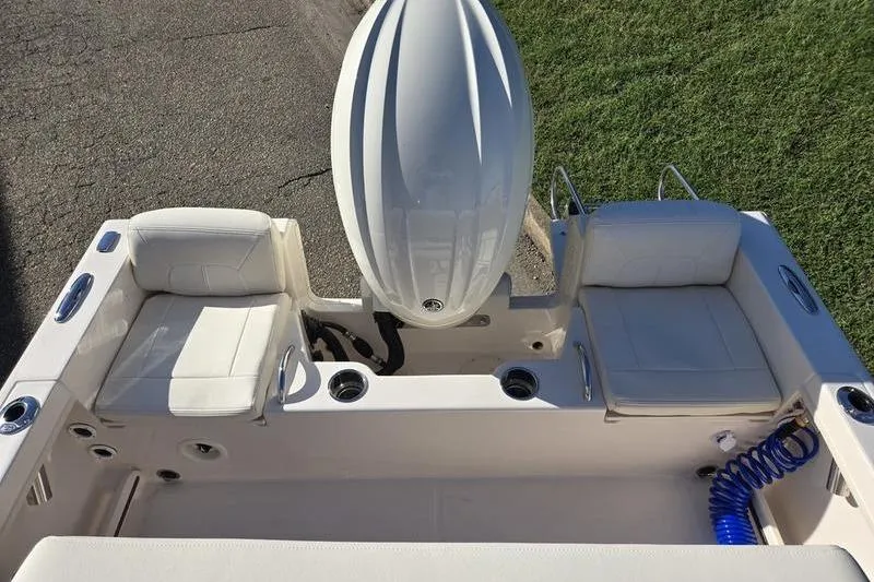 Slide: The Image of 2026 Grady-White Fisherman 180 boat interior with seating and engine view. - 8