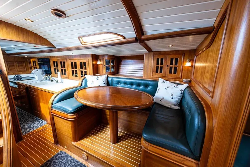 Slide: The Image of Luxurious 1974 C&C 61 Ocean Racer interior with wood finish and cozy seating area. - 11