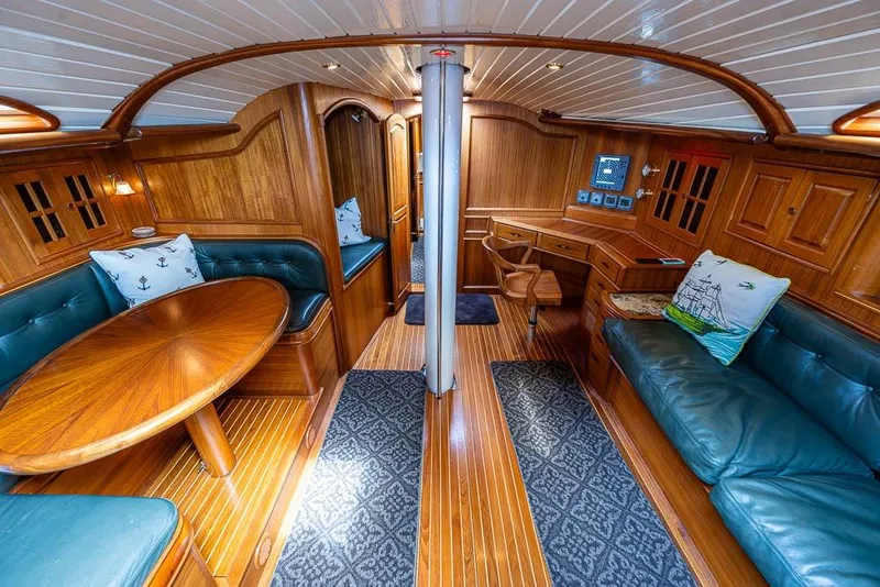 Slide: The Image of Luxurious 1974 C&C 61 Ocean Racer/Cruiser interior with wood finish and green leather seating. - 12