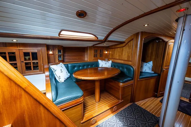 Slide: The Image of Luxurious wooden interior of 1974 C&C 61 Ocean Racer/Cruiser with cozy seating area. - 13