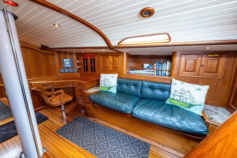 Slide: The Image of Luxurious 1974 C&C 61 Ocean Racer/Cruiser interior with wood paneling and blue leather seating. - 14