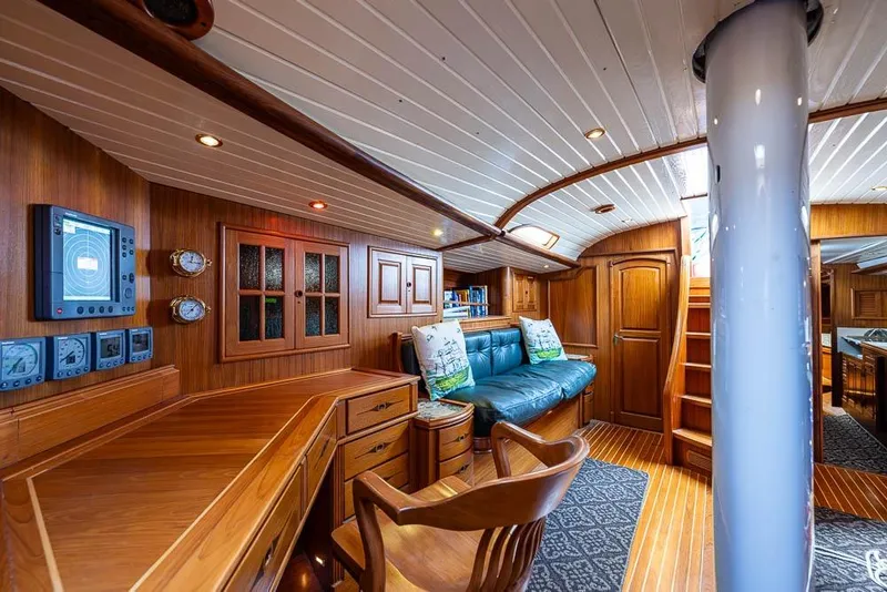 Slide: The Image of Luxurious 1974 C&C 61 Ocean Racer/Cruiser interior with wooden furnishings and cozy seating. - 15