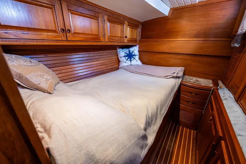 Slide: The Image of Cozy wooden cabin interior of 1974 C&C 61 Ocean Racer/Cruiser with bed and storage. - 20