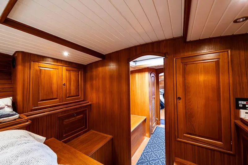 Slide: The Image of Interior of 1974 C&C 61 Ocean Racer/Cruiser with elegant wooden paneling and cozy cabin. - 22