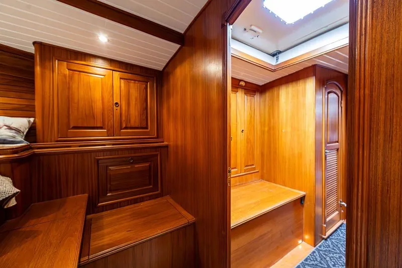 Slide: The Image of Interior of 1974 C&C 61 Ocean Racer/Cruiser with polished wooden cabinetry and seating. - 25
