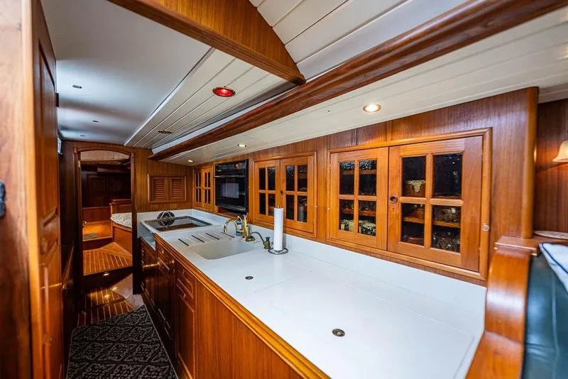 Slide: The Image of Luxurious wooden interior of 1974 C&C 61 Ocean Racer/Cruiser yacht kitchen. - 34