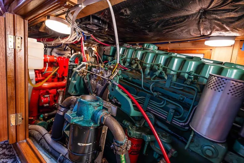 Slide: The Image of Engine room of a 1974 C&C 61 Ocean Racer/Cruiser with visible machinery and wiring. - 39