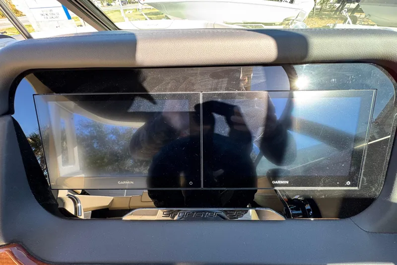 Slide: The Image of Dashboard of 2026 Chris-Craft Sportster 28 with dual Garmin displays. - 28