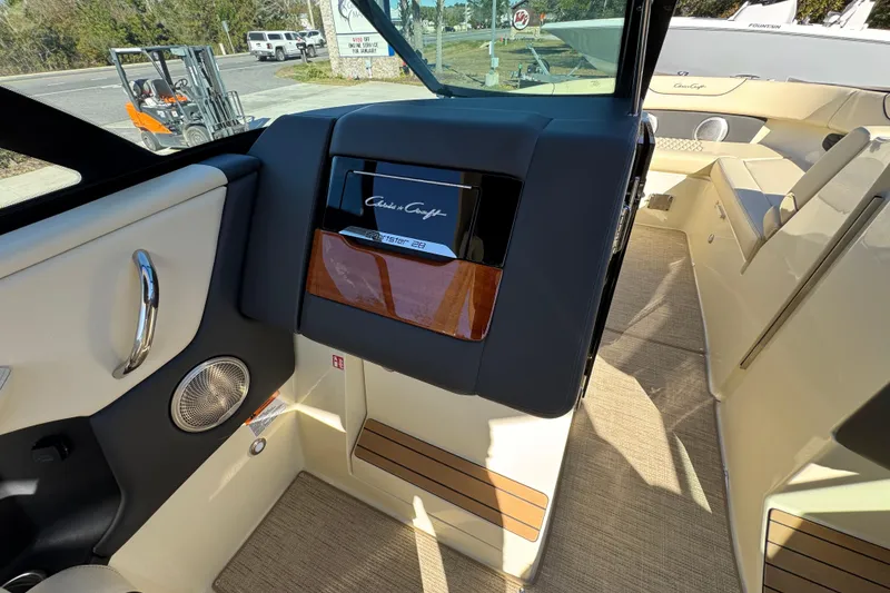 Slide: The Image of 2026 Chris-Craft Sportster 28 interior with sleek design and luxurious seating. - 32