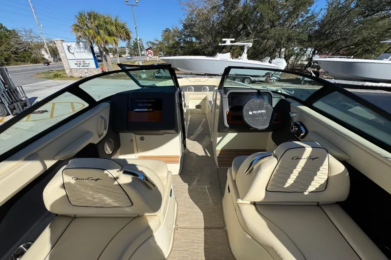 Slide: The Image of 2026 Chris-Craft Sportster 28 interior with luxurious seating and modern dashboard. - 34