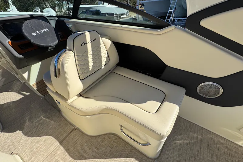 Slide: The Image of 2026 Chris-Craft Sportster 28 interior with beige seating and sleek design. - 36