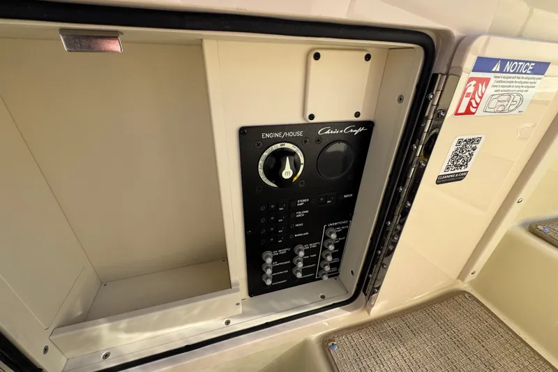 Slide: The Image of Control panel of 2026 Chris-Craft Sportster 28 boat, featuring engine and house switches. - 39