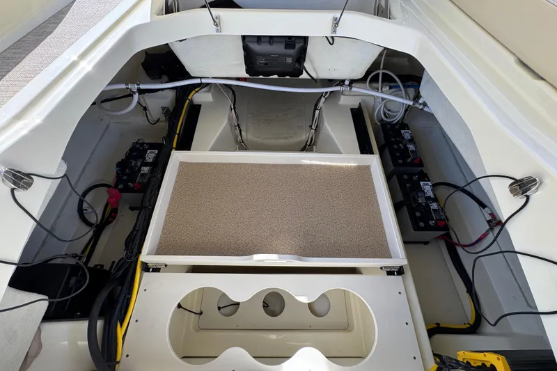 Slide: The Image of 2026 Chris-Craft Sportster 28 engine compartment with batteries and wiring. - 41