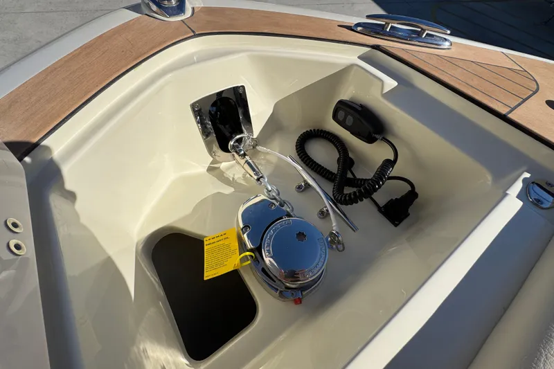 Slide: The Image of 2026 Chris-Craft Sportster 28 boat interior, featuring control panel and equipment. - 44