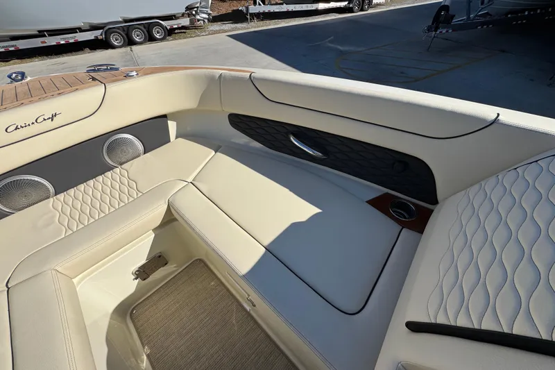 Slide: The Image of Luxurious interior of 2026 Chris-Craft Sportster 28 boat with elegant seating and speakers. - 46