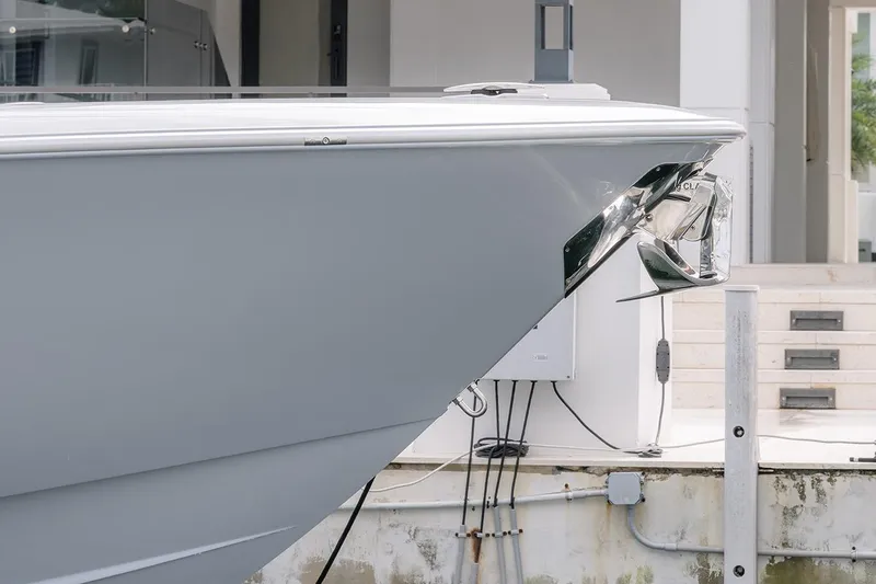 Slide: The Image of 2024 Contender 44 ST boat bow with sleek design and modern anchor. - 14