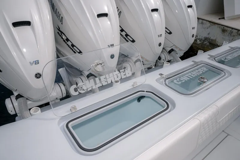 Slide: The Image of 2024 Contender 44 ST boat with Yamaha V8 engines and Contender-branded compartments. - 23
