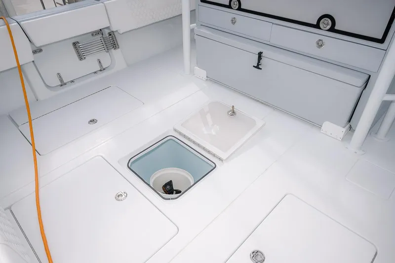 Slide: The Image of 2024 Contender 44 ST boat deck with storage compartments and sleek design. - 25