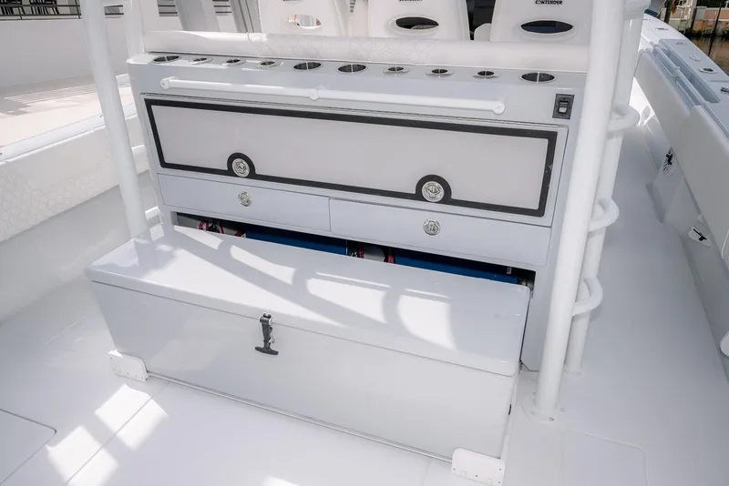 Slide: The Image of 2024 Contender 44 ST boat interior with storage compartments and seating. - 27