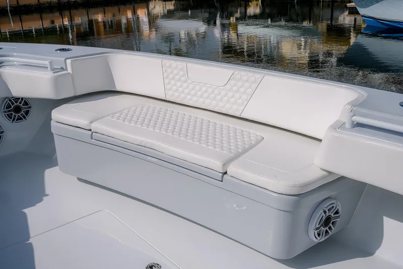 Slide: The Image of 2024 Contender 44 ST boat with white cushioned seating and sleek design. - 43