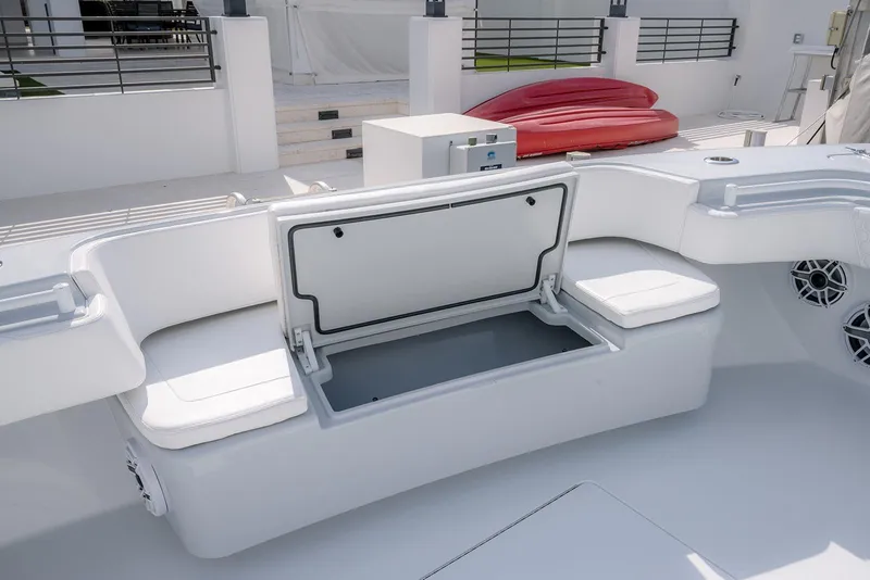 Slide: The Image of 2024 Contender 44 ST boat interior with open storage compartment and seating. - 45