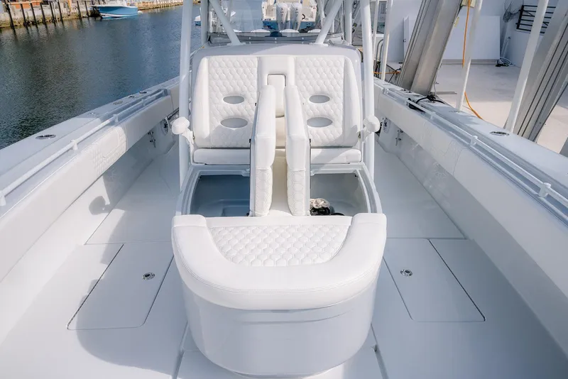 Slide: The Image of 2024 Contender 44 ST boat interior with white seating and sleek design. - 55