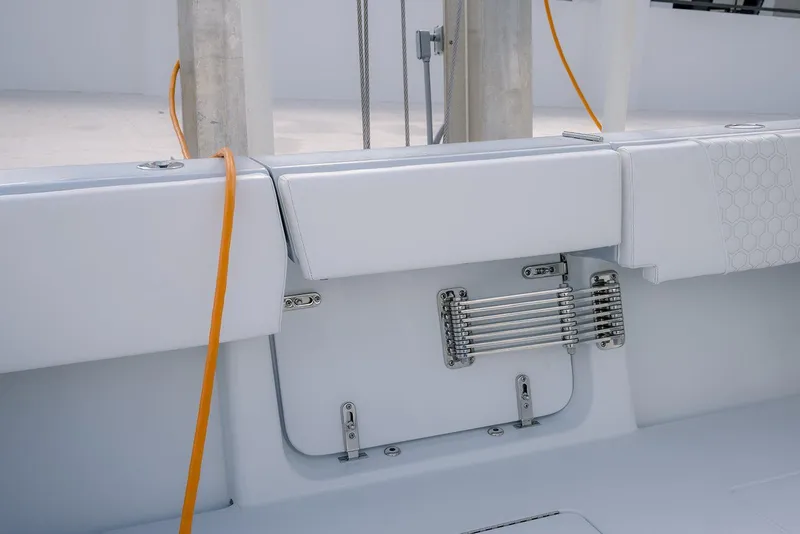 Slide: The Image of 2024 Contender 44 ST boat interior with white seating and orange cable. - 62
